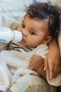 why babies squrim while feeding